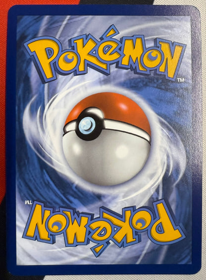 Charmander #7 – Paldean Fates (Cosmos Holo)